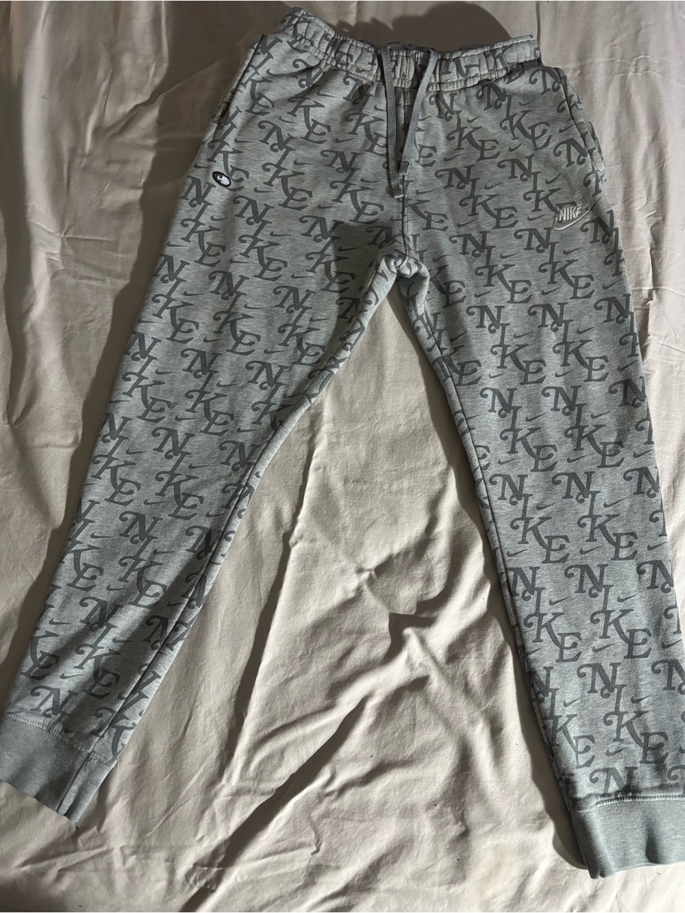 Nike Men’s Gray Allover Logo Joggers
